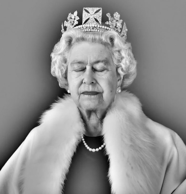 A late queen wearing a necklace of pearly teeth